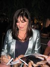 Anjelica Huston signing proof