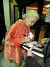 France Nuyen signing proof