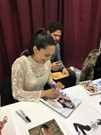 Raquel Pomplun signing proof